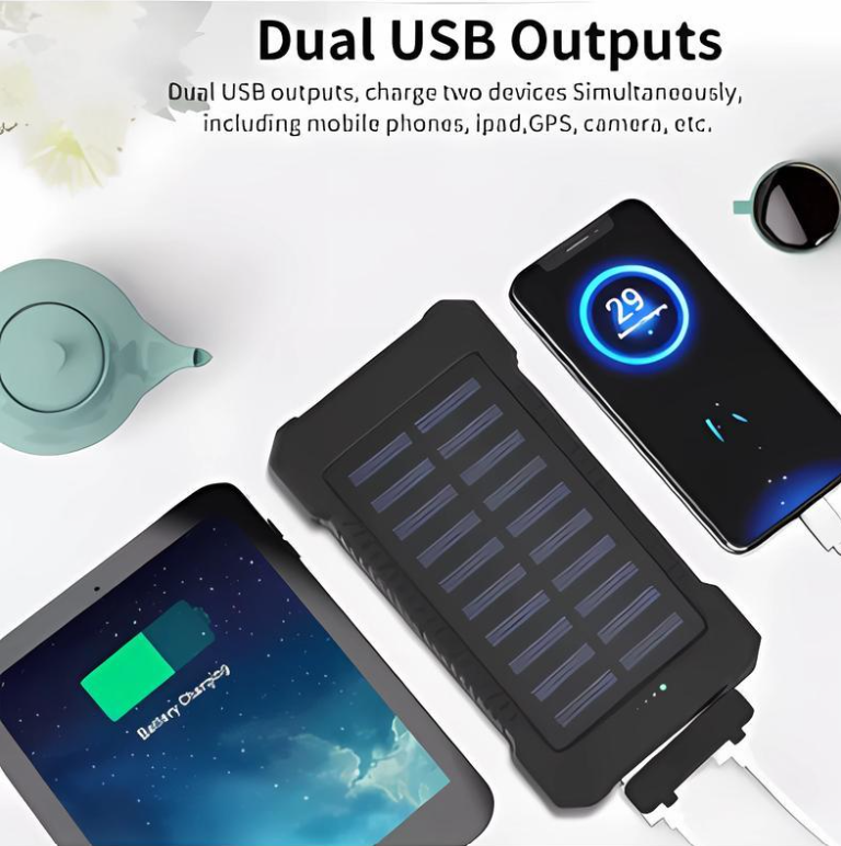 Solar power bank with dual USB outputs charging a smartphone and tablet on a white background.
